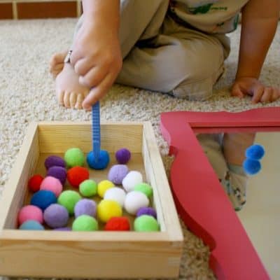 Toddler Activities: Play with Pompoms, Cardboard Tube and a Mirror