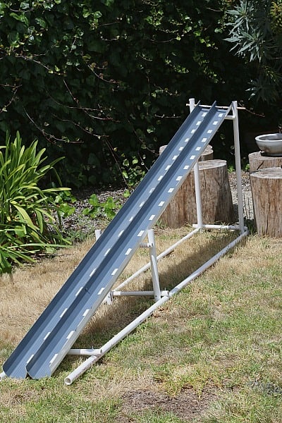 homemade car ramp using PVC pipes and rain gutters