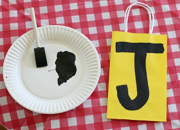 paint the child's initial in black