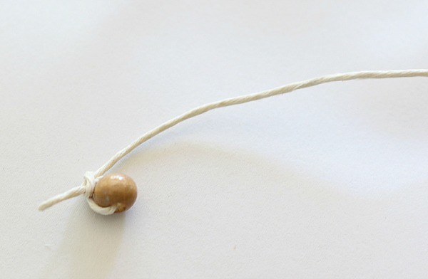tie a bead on the end of the string
