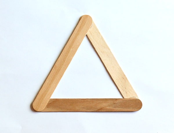 glue your popsicle sticks together to form a triangle