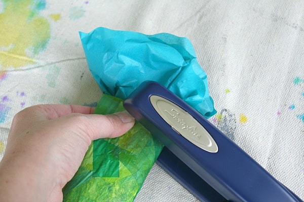 staple your tissue paper circles to the paper towel roll flower stem