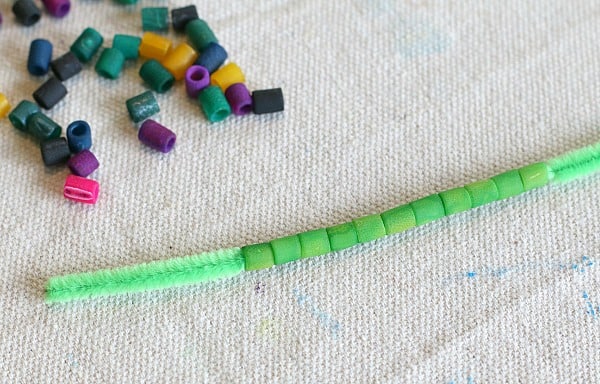 string pasta onto pipe cleaners