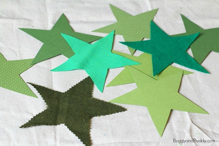 cut out the green stars for the christmas ornament craft for kids