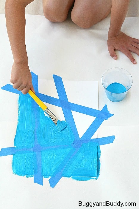 paint over your entire canvas, including over the painter's tape to create a resist effect