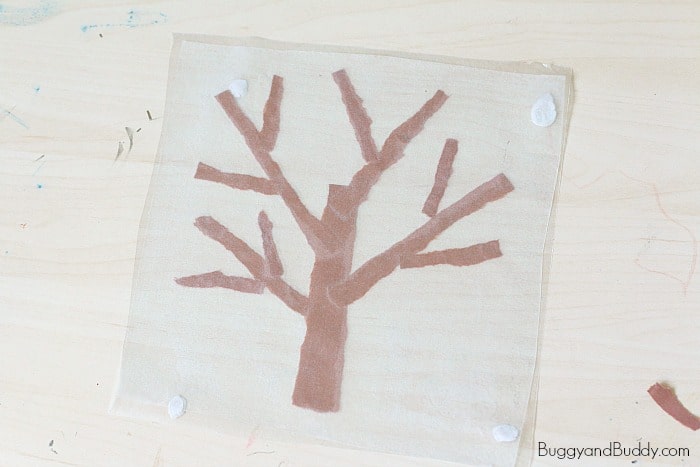winter tree suncatcher craft for kids using tear art