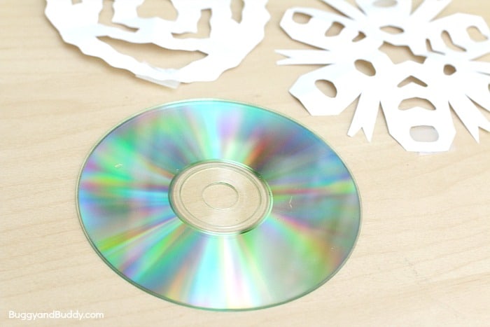 STEM / Science for Kids: Exploring Rainbow Reflections with a CD and Paper Snowflakes- fun way to explore light! 
