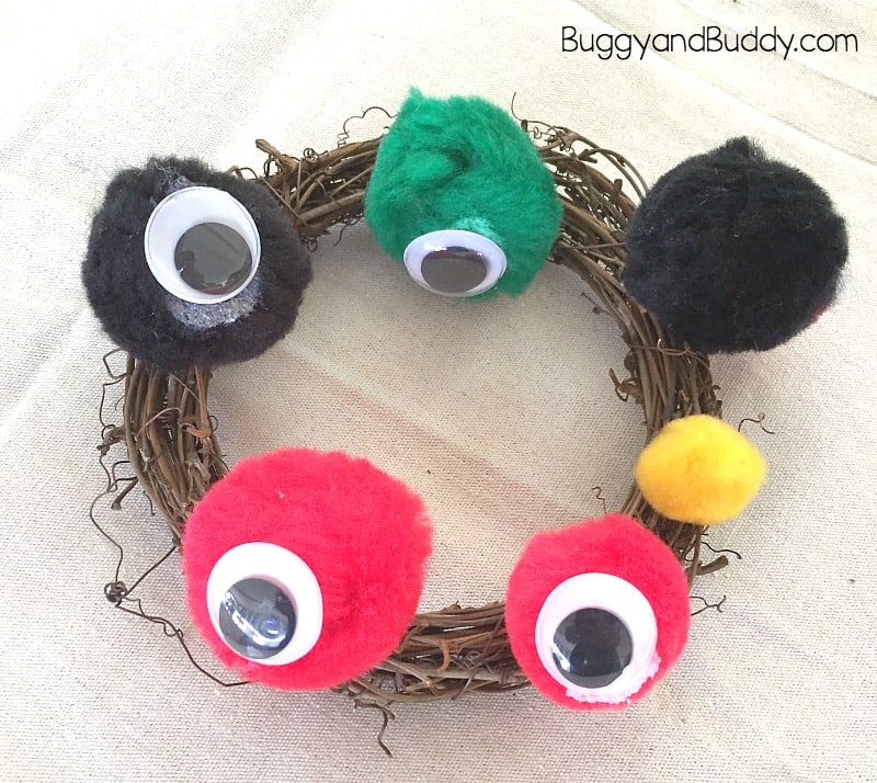 easy halloween wreath craft for kids monster eyes