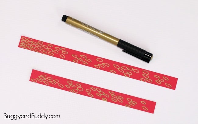 decorate your red paper strips to make your fish craft