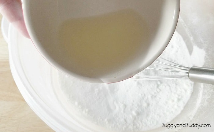 add the liquid mixture to the dry mixture of your bath bomb recipe
