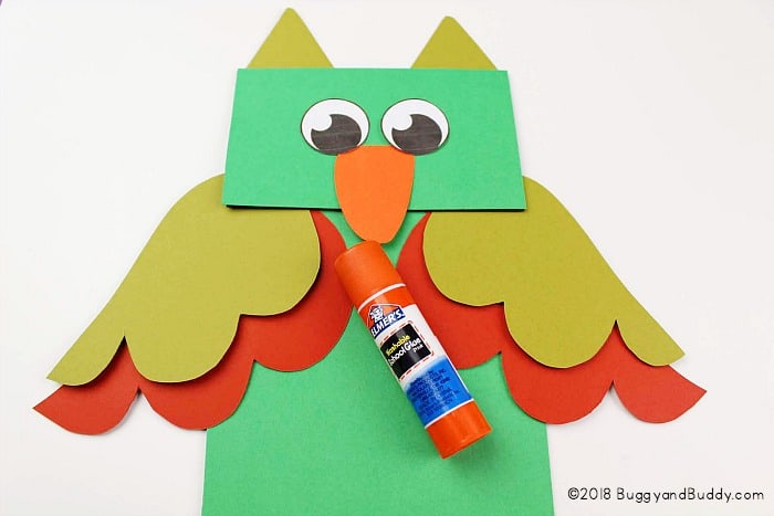 glue your owl pieces to your paper bag puppet