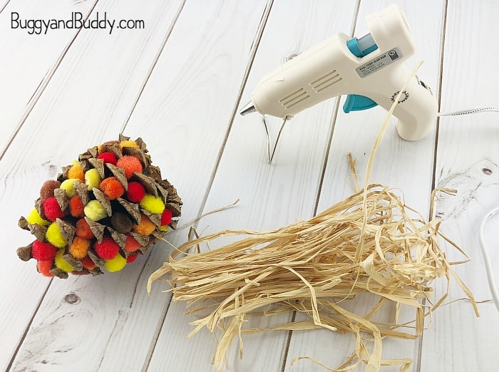 cut raffia for the top of your pinecone indian corn craft